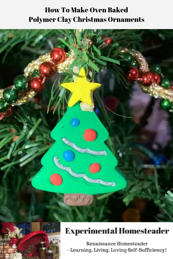 A finished polymer clay Christmas ornament hanging on a Christmas tree.