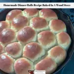 The ready to eat homemade dinner rolls recipe resting in the cast iron skillet on top of the wood burning cook stove.