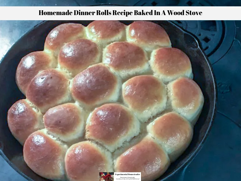 The ready to eat homemade dinner rolls recipe resting in the cast iron skillet on top of the wood burning cook stove.