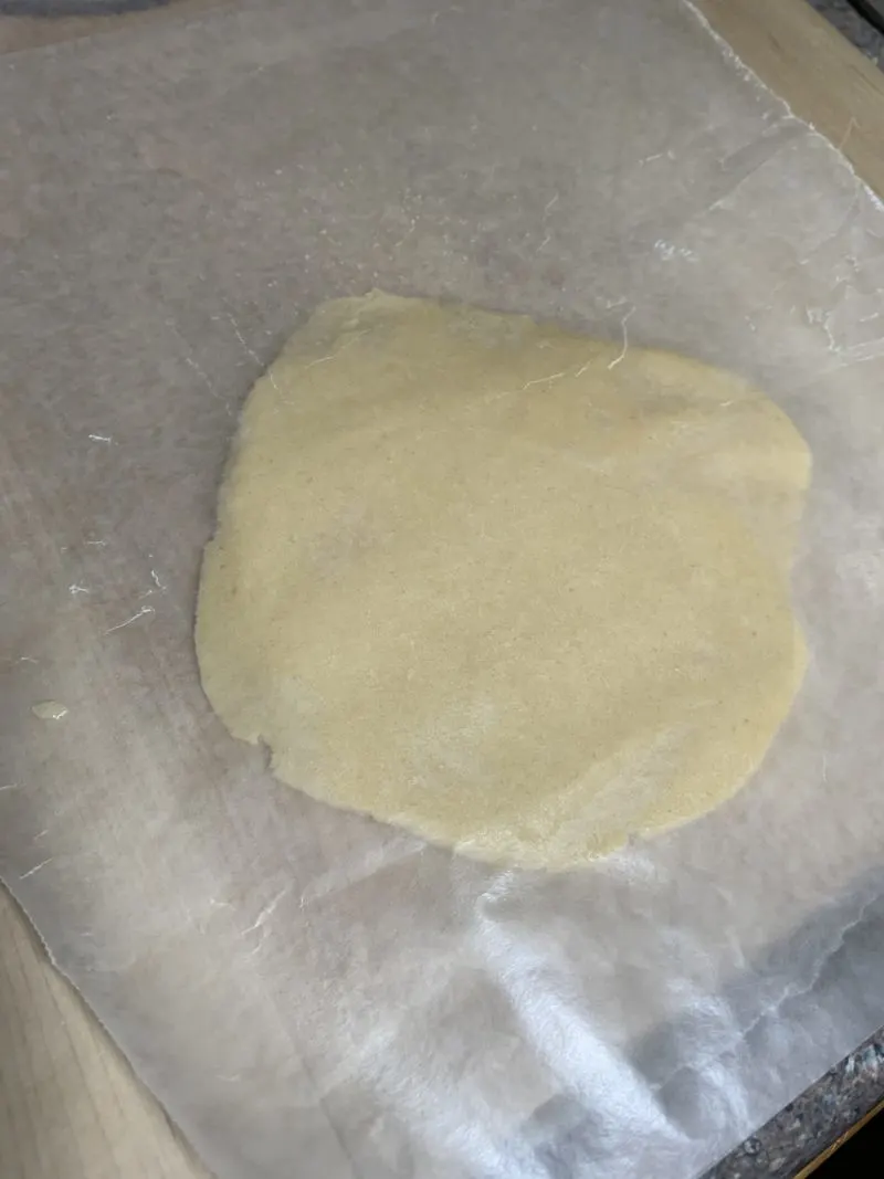 The sugar cookie dough rolled out to approximately 1/2 inch thick.