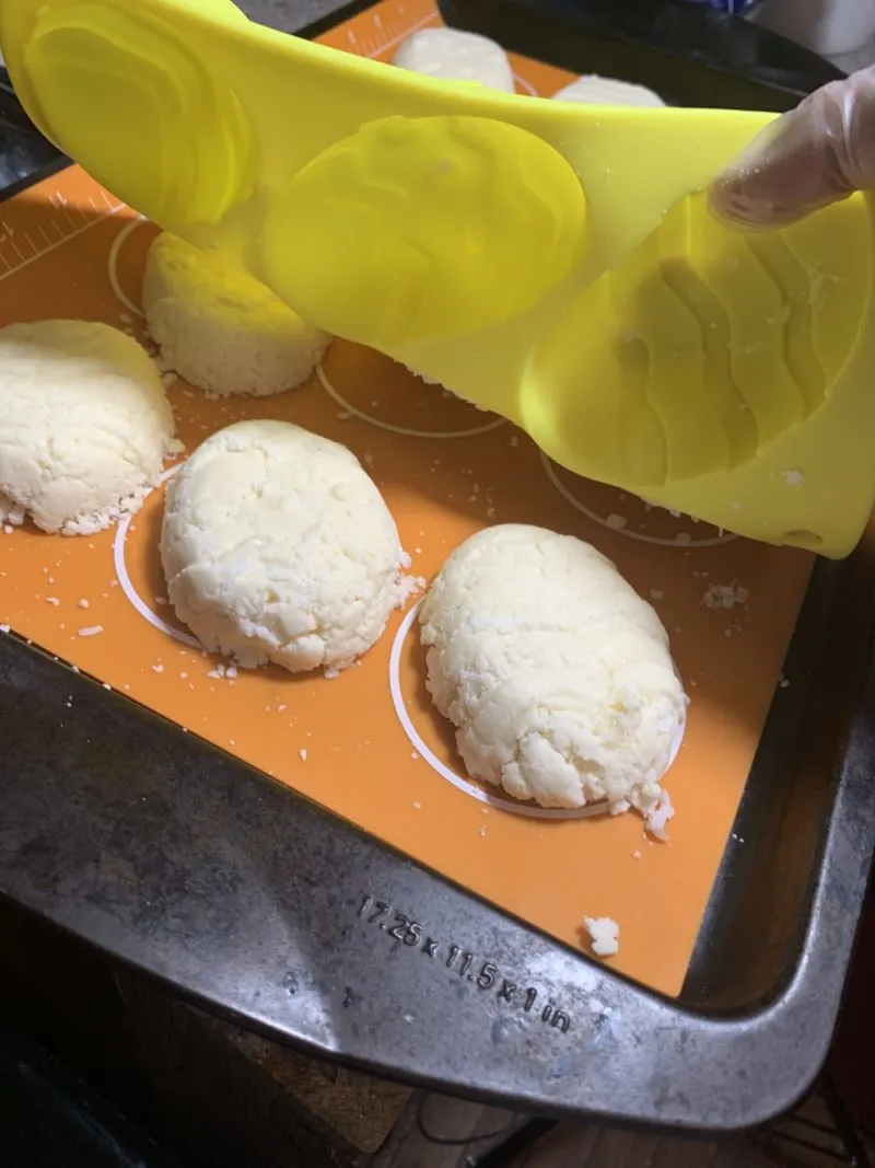 The coconut creme filling being removed from the mold.