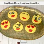 Decorated emoji sugar cookie ideas laid out on a platter.