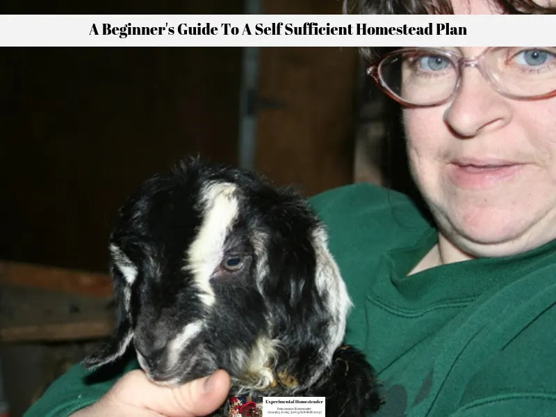 Sheri Ann Richerson holding one of the baby goats born here at the farm.