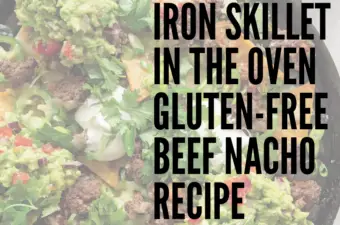 The beef nachos ready to serve in a cast iron skillet.