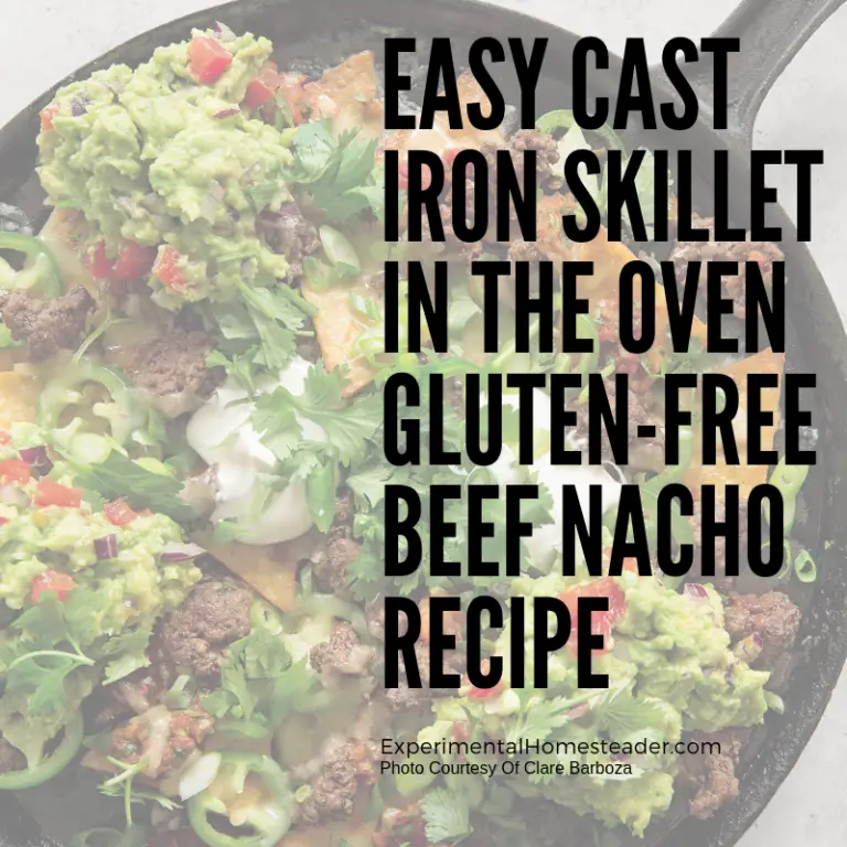 The beef nachos ready to serve in a cast iron skillet.