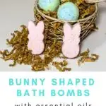 Bunny bath bombs sitting in front of a nest filled with bird egg bath bombs.