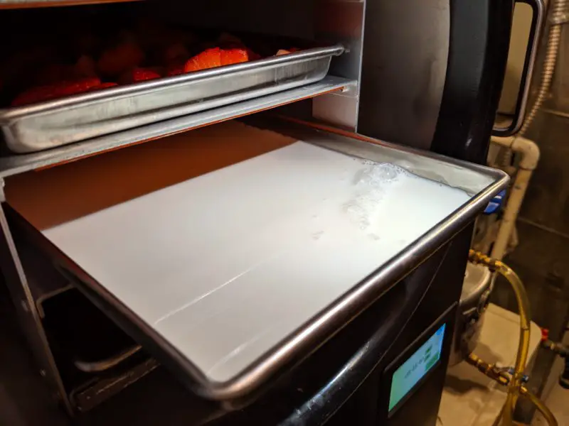 Milk in a freeze dryer tray.