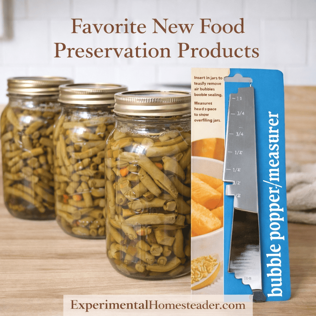 Canned green beans in mason jars on a farmhouse kitchen countertop beside a bubble popper headspace measurer for food preservation.