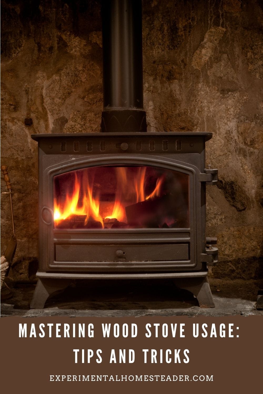 Rustic cast iron wood stove with a glowing fire set against a stone wall background.
